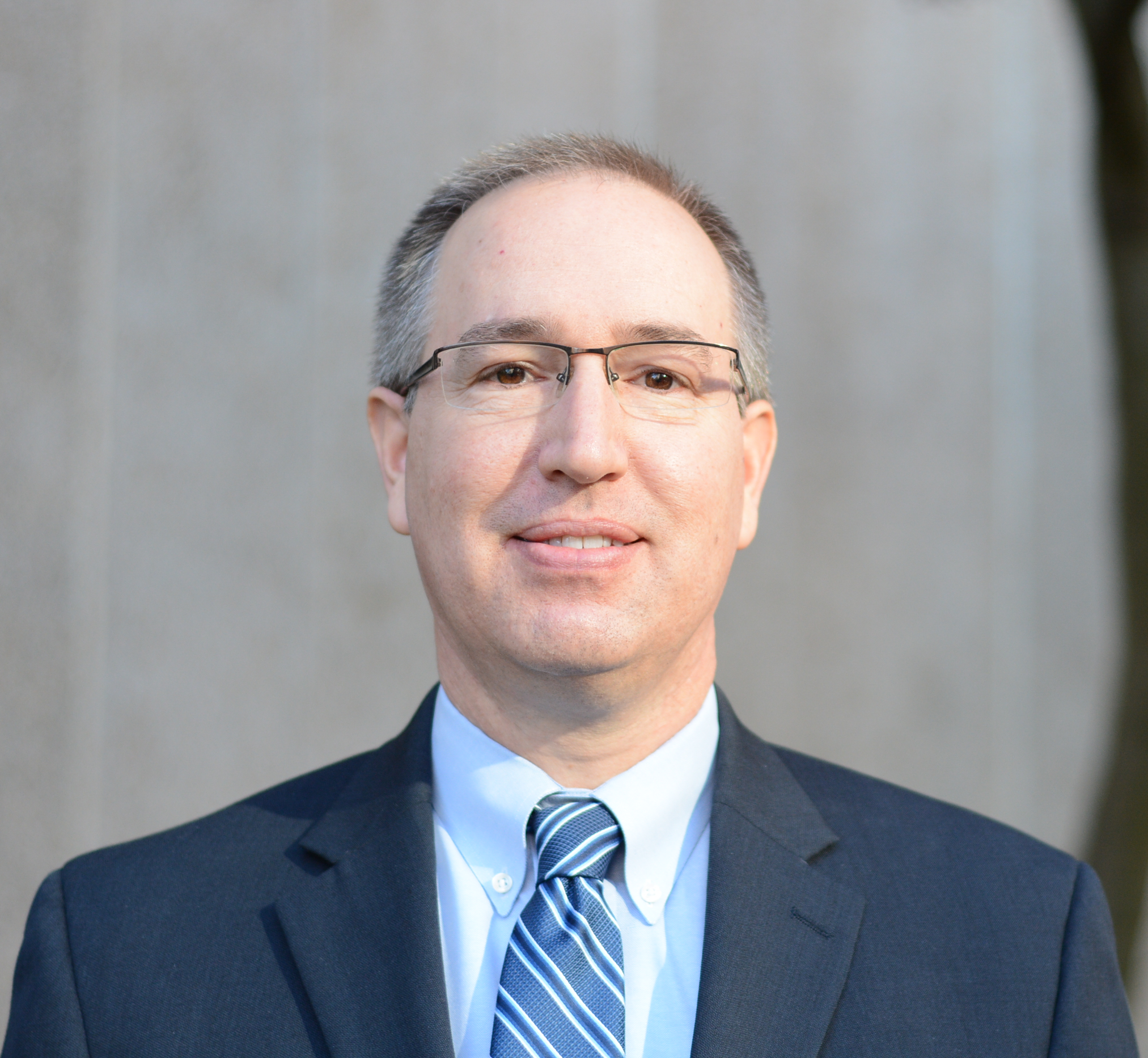 Man in blue suit with tie