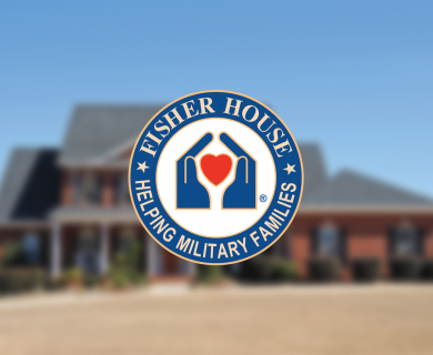 Blurred out house against blue sky with official Fisher House Logo over top
