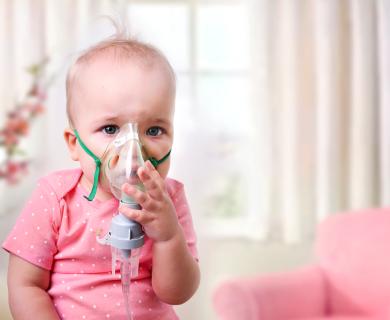 Baby with oxygen mask