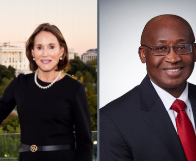 Side by side image of white woman in black suit with Capital building in the background next to an African American man in black suit with red tie against a grey background
