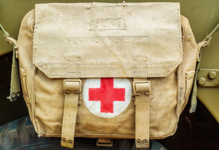 Medical bag with red cross on it