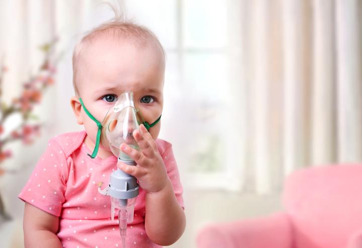 Baby with oxygen mask