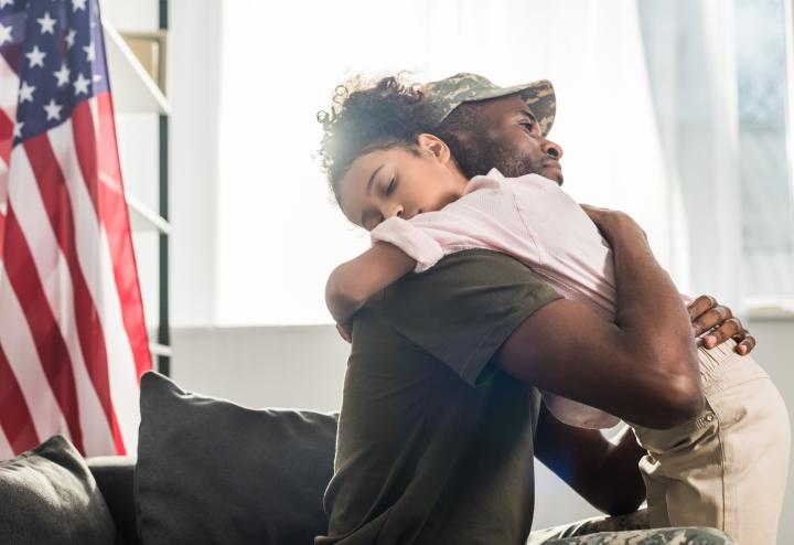 Hugging Military Father and Child Hugging Military Father and Child