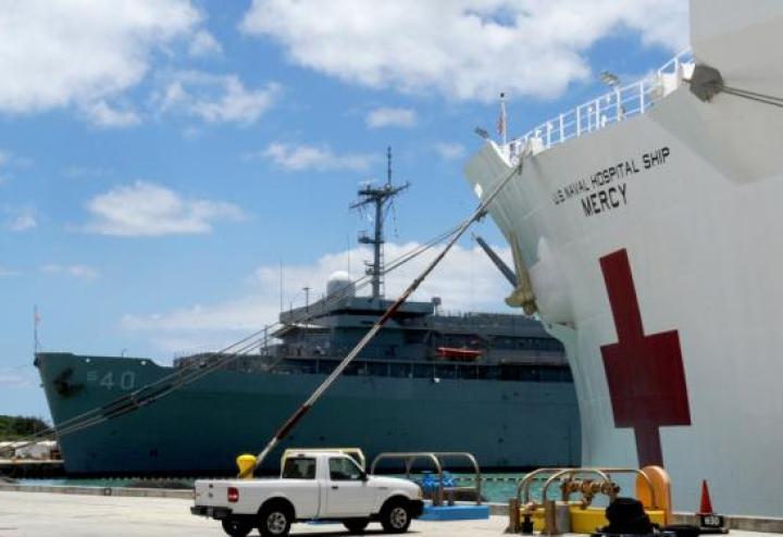 USS Mercy at dock in the sun.