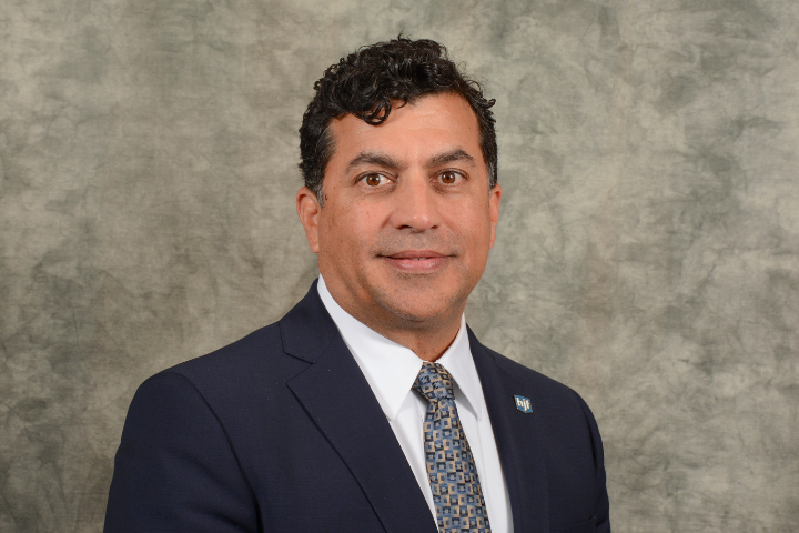 photo of doctor Stephen Dalal mixed race man executive in business suit