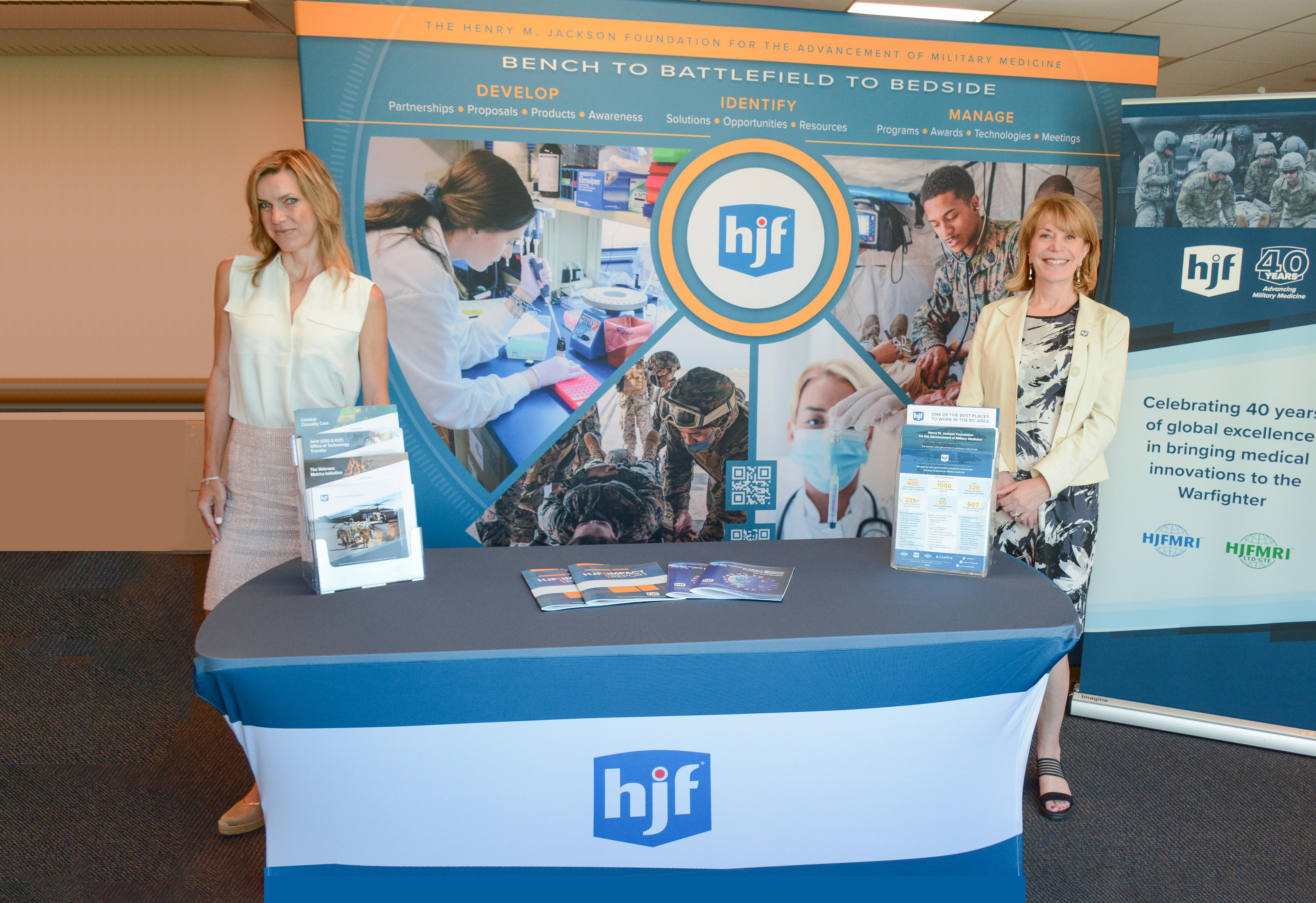 HJF business development team in front of trade booth