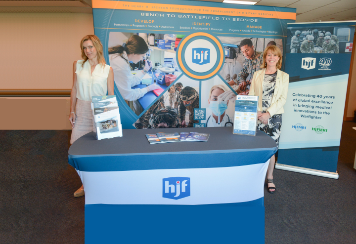 HJF business development team in front of trade booth