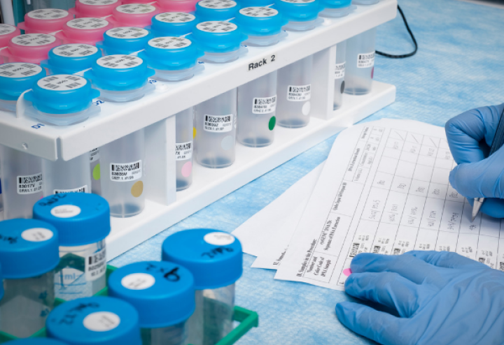 Researcher writing in laboratory