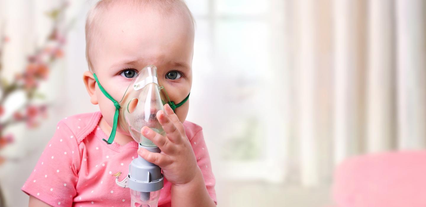 Baby with oxygen mask